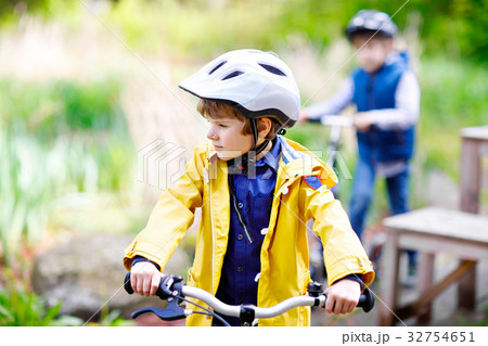 Two little kids boys driving and running on Two little kids boys driving and running on 32754651