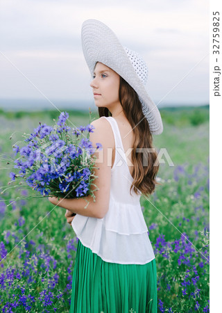 Girl with a bouquet of lavender Girl with a bouquet of lavender 32759825
