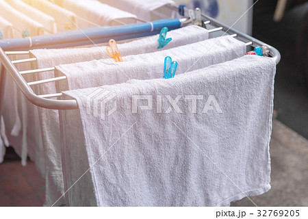 white towel on clothesline in sunny day white towel on clothesline in sunny day 32769205