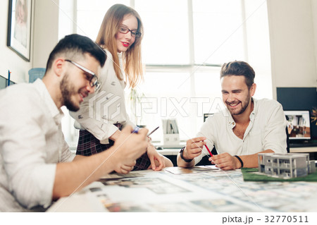 team of engineers working together in a studio. team of engineers working together in a studio. 32770511