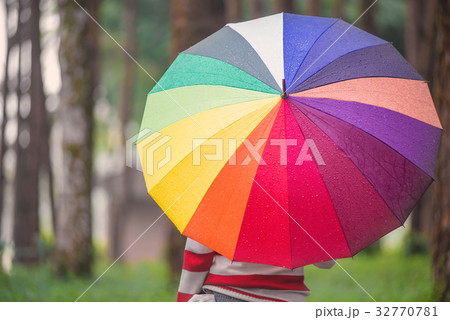 Beautiful women with colorful umbrella standing 32770781