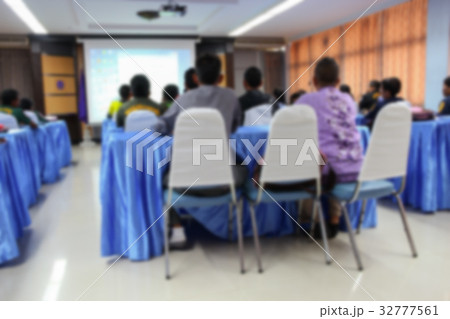 Blur Student sitting in classroom with teacher Blur Student sitting in classroom with teacher 32777561