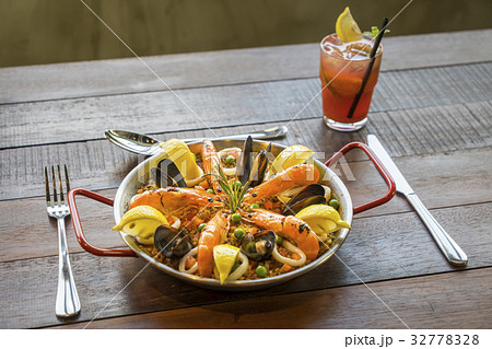 Paella with seafood vegetables and saffron Paella with seafood vegetables and saffron 32778328