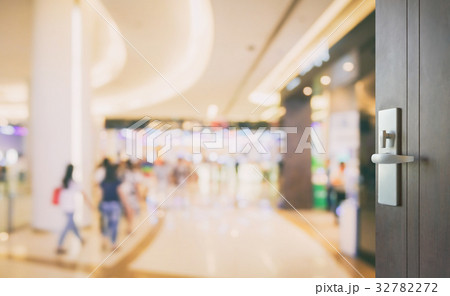 opened wooden door to department store 32782272