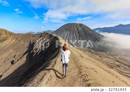 tourist walking through on the craters of Bromo tourist walking through on the craters of Bromo 32791935