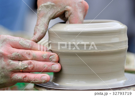 Potter making ceramic pot on the pottery wheel Potter making ceramic pot on the pottery wheel 32793719