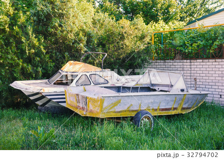 Two old abandoned boats in the yard Two old abandoned boats in the yard 32794702