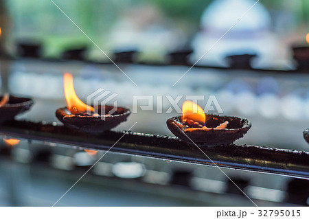 Coconut oil lamps in temple 32795015