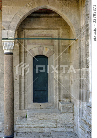 Old green mosque wooden door 32795873