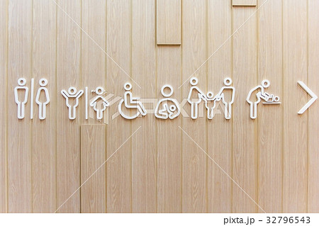 Symbols for toilet sign on wooden background Symbols for toilet sign on wooden background 32796543