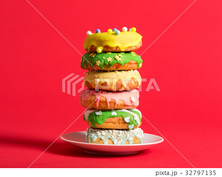Colorful glazed donuts on a bright background 32797135