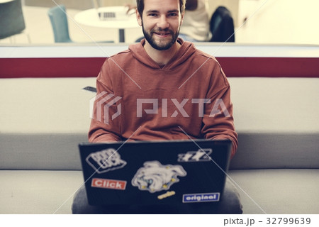 Man working on laptop networking technology 32799639