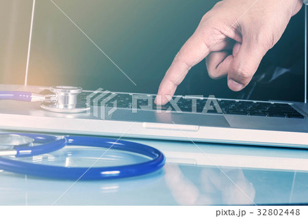 Hands typing on a computer. Hands typing on a computer. 32802448