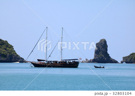 Sailboat sailing between islands Sailboat sailing between islands 32803104