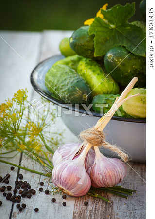 Fresh cucumbers in bowl and spices for pickling 32803935