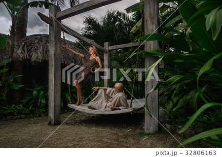 Couple on swinging bench Couple on swinging bench 32806163