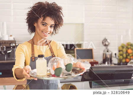 Happy charming girl is working in organic shop 32810649