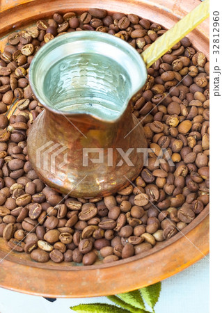 Old style copper coffee pot cezve and beans 32812960