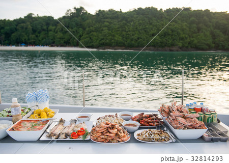 Many grilled seafood served buffet style  32814293