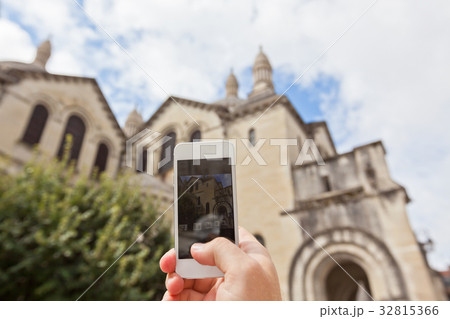 Tourist taking photo of Perigueux, France Tourist taking photo of Perigueux, France 32815366