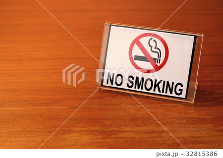 no smoking sign on wooden table no smoking sign on wooden table 32815386