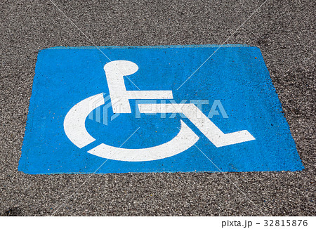 Disability symbol painted on the floor at parking 32815876