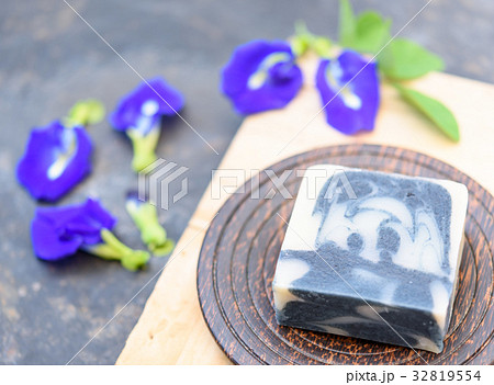 Handmade indigo soap on wooden dark background 32819554