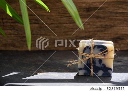 Handmade indigo soap on wooden dark background 32819555