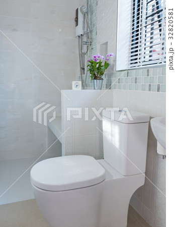 Modern bathroom with Alarm clock and orchid flower 32820581