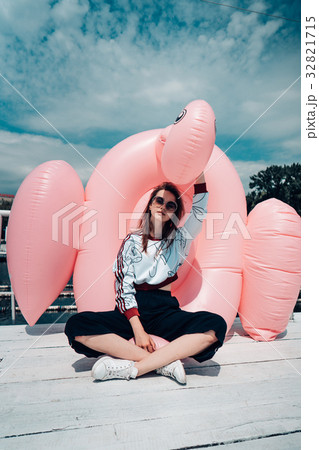 Young beautiful girl posing on the pier 32821715