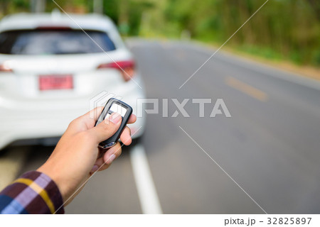 Men on hipster shirt, hand presses on the remote Men on hipster shirt, hand presses on the remote 32825897