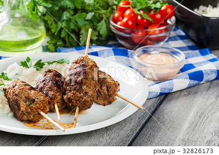 Barbecued kofta with rice on a plate Barbecued kofta with rice on a plate 32826173