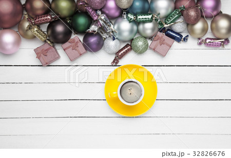 Coffee cup and christmas toys on white background. Coffee cup and christmas toys on white background. 32826676