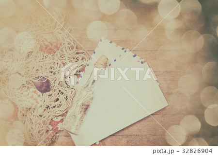 Net, envelopes and shells with bottle 32826904