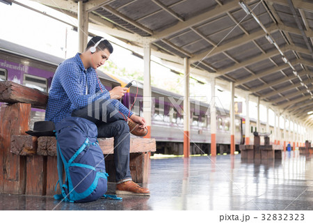 man traveler with backpacker listening to music 32832323