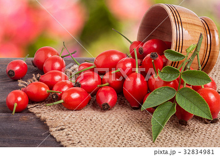 Fresh rosehip berries in a wooden bowl on the 32834981