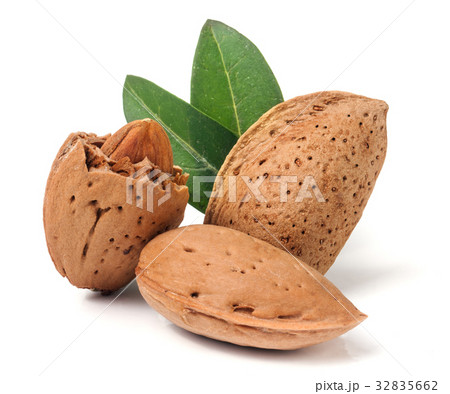 almonds in their skins and peeled with leaf almonds in their skins and peeled with leaf 32835662