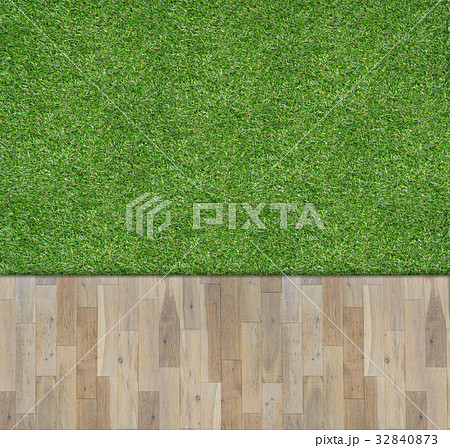 Wooden board on green grass 32840873