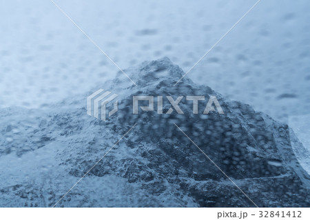 Abstract of Rain drop over the snow mountain background 32841412