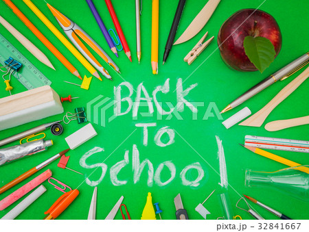 School supplies on Green chalkboard " Back to school background " . School supplies on Green chalkboard " Back to school background " . 32841667