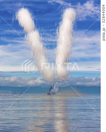 Solemn gun salvo on a military ship 32844004