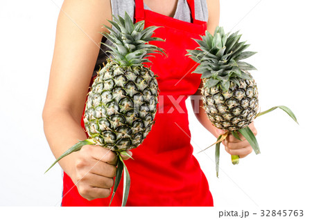 Green pineapple fruit holding by hand 32845763