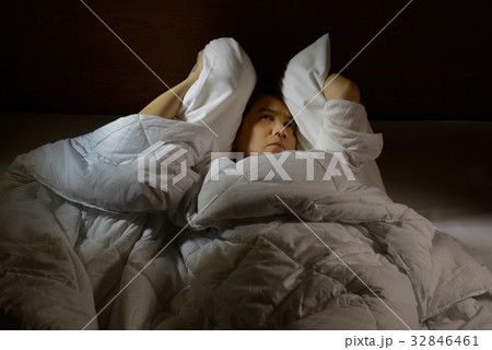 Woman with insomnia lying in bed with open eyes 32846461