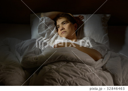 Woman with insomnia lying in bed with open eyes 32846463