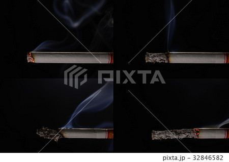 Lit and burning cigarette with smoke 32846582