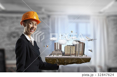 Woman presenting construction project. Mixed media Woman presenting construction project. Mixed media 32847624