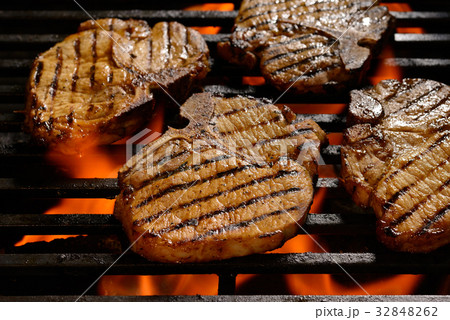 Grilled pork steak on the flaming grill Grilled pork steak on the flaming grill 32848262