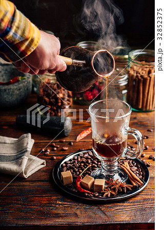 Man Pour Coffee in Mug. 32852375