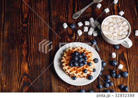 Waffles with Blueberry and Hot Chocolate. 32852388