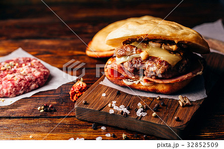 Cheeseburger on Cutting Board. Cheeseburger on Cutting Board. 32852509